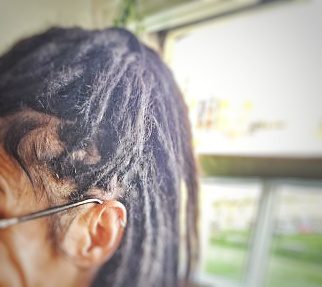 Close-up of tailor-made human hair dreadlock extensions showing colour and texture