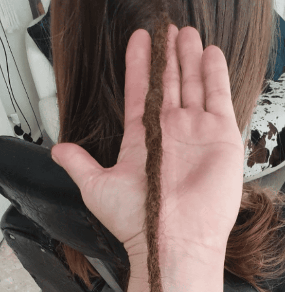 Permanent human hair dreadlock extensions maintained for long-term wear