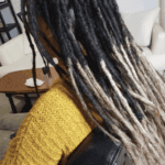 Permanent dreadlock extensions added to existing locs for natural-looking length