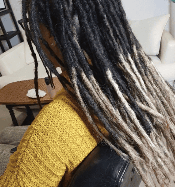 Permanent dreadlock extensions added to existing locs for natural-looking length