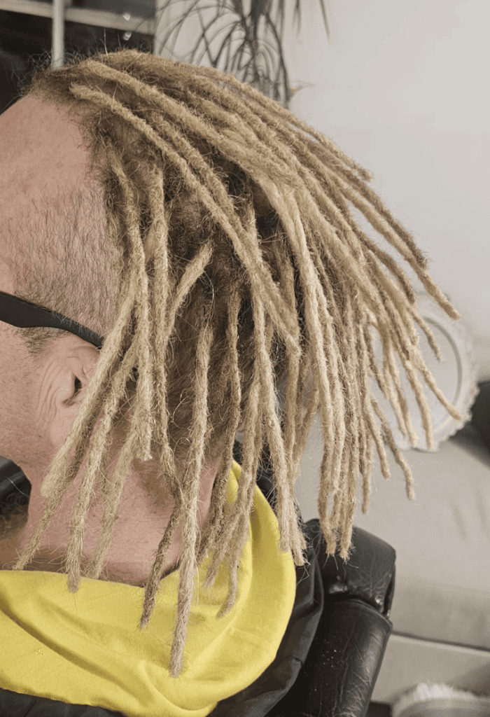 Permanent human hair dreadlock extensions showing a finished full-head result in the UK