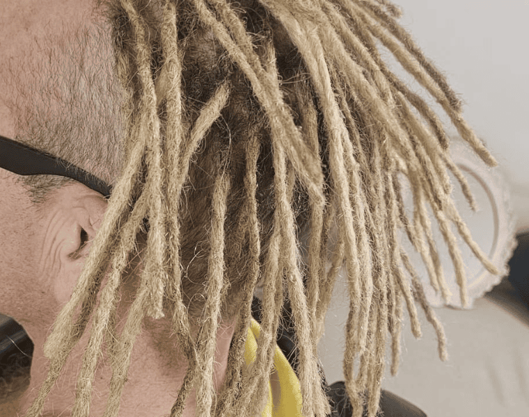 Permanent human hair dreadlock extensions showing a finished full-head result in the UK